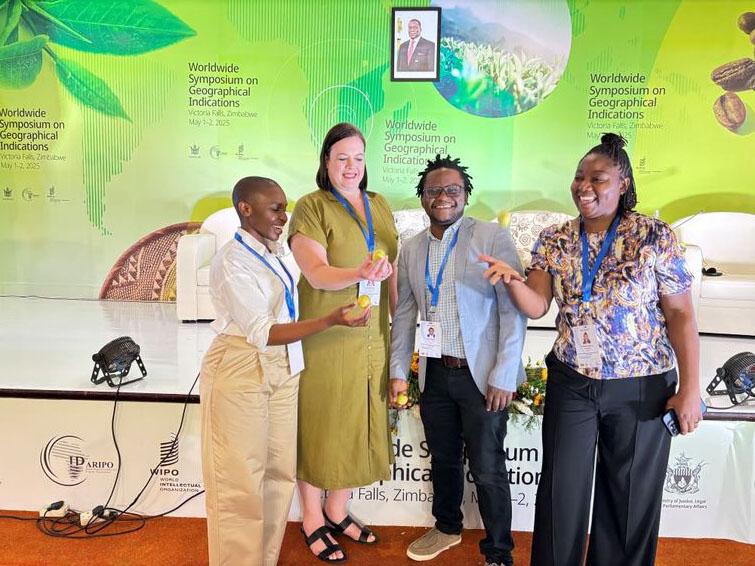 Group of 4 people holding something in their hands